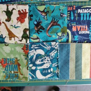 Jurassic Dinosaur themed Charm Pack Quilt Kit all materials needed to make a small quilt Charm squares, backing and wadding + info sheets
