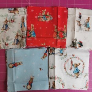 Peter Rabbit Christmas Fabric Charm Pack Quilt Kit all materials needed to make a baby quilt Charm squares, backing and wadding + info sheet